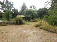113 Acacia Road Grantville VIC 3984 Blue Stone Cottage with Sea Views Set on nearly 1.5 Acres this Blue Stone cottage is magical! From this hill top land you can easily see Western Port bay and beyond between the tall trees. This property also has a huge 3 bay garage and ample storage space. The garden has been extensively planted with native trees and shrubs yet there is still plenty of clear sunny spaces. There is lots of well surfaced driveway access all around the property and parking capacity for a dozen or more cars. Would suit someone with a boat, caravan, truck etc. The cottage is includes an open fire place and roof top lookout to take in the veiw. There is lots of level ground adjoining the cottage to allow for extensions into the future. A very unique and special property that you could easily fall in love with! General Features Property Type: House Bedrooms: 1 Bathrooms: 1 Land Size: 0.57ha (1.41 acres) (approx) Indoor Features Workshop Open Fireplace Outdoor Features Secure Parking Garage Spaces: 3 Deck Outdoor Entertaining Area Shed