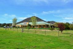 2626 Maroondah Highway Mansfield VIC 3722 129 ACRES MANSFIELD LIFESTYLE FARM Set upon 129 acres of gently undulating grazing country, this superb lifestyle farm awaits. The solid brick homestead is set amidst beautifully landscaped gardens to capture picturesque rural views from its wide and shady return verandahs. Immaculately presented throughout, the home comprises 4 generous bedrooms and 2 bathrooms. Master bedroom with ensuite and WIR. The fully equipped modern kitchen features quality, stainless appliances plus the latest new generation combustion stove, dishwasher & butlers-walk in pantry. Spacious, combined dining and family living and a huge formal lounge and recreation room provide space for every member of the family in this grand lifestyle home. Outside, a large undercover entertaining area features a huge open fireplace for atmospheric evenings with friends and family whilst theres also a massive 4 car garage under the roofline. Your farming needs are amply catered for with hay shed, feed silo, shearing shed, yards and a solid cattle crush & ramp plus bore with established garden watering system plus 3 massive domestic rain water tanks to provide 28,000, 25,000 & 4,000 gallons each. General Features Property Type: House Bedrooms: 4 Bathrooms: 2 Land Size: 52.20ha (129.00 acres) (approx) Indoor Features Ensuite: 1 Toilets: 2 Study Workshop Built-in Wardrobes Dishwasher Split-system Heating Split-system Air Conditioning Reverse-cycle Air Conditioning Air Conditioning Outdoor Features Remote Garage Secure Parking Carport Spaces: 2 Garage Spaces: 4 Open Car Spaces: 1 Balcony Outdoor Entertaining Area Shed Fully Fenced Eco Friendly Features Water Tank $1,150,000