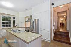 20-22 Kerry Road Warranwood VIC 3134 **** UNDER CONTRACT **** Tucked in an exclusive and infinitely peaceful pocket of Warranwood is this irresistible family home that immerses you in bushland vistas and beautiful birdsong. The spacious and welcoming interior is beautifully presented, featuring 3 living zones and easy indoor/outdoor flow to an immaculate landscaped garden. Adjoining the Candlebark Reserve provides a luxurious sense of space for this impeccable home ? built with family life in mind. - Attractive brick home set amid leafy landscaped gardens in park side location - Granite kitchen with 900mm s/steel cooker, Asko dishwasher, and bay window - Open kitchen/meals/family zone warmed by a gas log fire, with bay window and deck access - The elegant lounge enjoys a Victorian open fireplace and adjoining dining room - The spacious rumpus with timber flooring leads to the pretty rear garden - Master bedroom boasts walk thru robe to bright ensuite bathroom - A study and well appointed laundry complete the home?s interior - Features include ducted heating/refrigerative air conditioning, ducted vacuum, intercom, and powered under house workshop/storage - A large rear deck overlooks the Candlebark . General Features Property Type: House Bedrooms: 4 Bathrooms: 3 Land Size: 1995 m² (approx) Indoor Features Study Outdoor Features Garage Spaces: 2 $890,000 - $1,030,000