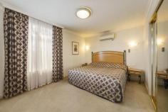221/44 Brunswick Street Fitzroy VIC 3065 Superb 4.5 Star Metropole Serviced Apartment One of Melbourne's most secure property investment opportunities, this fully serviced apartment in the 4.5 star Metropole Hotel Apartments and Conference Centre is perfectly placed to make an impressive blue chip addition to a discerning investor's portfolio. Located at the doorstep of the CBD with easy access by tram and foot to Fitzroy's famous cafe strips, Exhibition Building, Carlton Gardens, Lygon Street, MCG and hospitals; this modern one bedroom, 2nd-floor apartment with a guaranteed income of $17,619.84 pa being a 5.87% rental return, features a prime corner position, fully-furnished interior, balcony overlooking pool, superb living and dining room, kitchenette, full bathroom with double-shower, master bedroom with a luxurious open spa bath, heating/cooling, lift access, secure basement parking, gym/pool facilities and 24-hour concierge. General Features Property Type: Apartment Bedrooms: 1 Bathrooms: 1 Indoor Features Indoor Spa Gym Built-in Wardrobes Outdoor Features Carport Spaces: 1 Balcony Swimming Pool - Inground