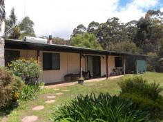 608 Boorara Road Northcliffe WA 6262 Just 6 Kilometres from the town of Northcliffe is this 79 Acre property with beautiful Karri and Jarrah trees and much more. Most of the road except approximately 1 kilometre to the property is bitumen. There is a very roomy house with 4 bedrooms, two living areas a kitchen and dining area and a spacious bathroom and laundry. One of the living areas in the house is huge and has wood fire as does the smaller lounge room. There are verandahs around three sides of the house making for more entertaining areas or just somewhere to sit and have a quiet read. This property has a lot of potential Sit on the front verandah and enjoy the views through karri trees to neighbouring farmland, and while there enjoy the abundant birdlife and wildlife. This is a very peaceful property being predominantly bush, however there is enough room for a horse or two. There is a small dam on the property with a pump to water the garden. A good size shed is not far from the house and another extra is a bird aviary.