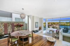 54A Burns Crescent Chiswick NSW 2046 sophisticated offering of unquestionable quality and refinement in a
blue ribbon harbourside setting, this breathtaking residence is quite
simply beyond compare. Flowing over three levels and finished to the
highest of standards, panoramic views stretch across the bay to the
distant skylines of North Sydney and the CBD. Occupying an elevated
setting that embraces privacy and tranquillity and flooded with natural
northern light throughout, this family home is designed for easy, low
maintenance entertaining. An ultra-contemporary masterpiece of rare
quality, it is minutes to parks and village life. Bright split level lounge and dining area, featuring in/outdoor ponds Marble tiled entertaining terrace, BBQ outlet and roof top garden Separate family room and theatre room / 4th bedroom with ensuite Generous master with walk-in robe, unique open ensuite with views Deluxe kitchen, CaesarStone island bench and glass splash-backs Sun-washed rear courtyard, sparkling lap pool with water feature Gas fireplace, heated tiled floor, polished timber and ducted air con