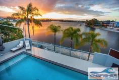 19 Kingfisher Crescent Burleigh Waters QLD 4220 Key Details property ID 274296 land size 965.00m2 build size 65.00sq Description MAGNIFICENT ARCHITECTUALLY DESIGNED HOME OVERLOOKING VAST WATER Australia’s most sought after beach side enclave offers one of its most prestigious homes for sale. Capture, be amazed and enjoy glorious golden sunsets over the hinterland. Relax on your secluded beach and be seduced by tranquil, serene moonlit nights over beautiful vast water with views of mountain range and beyond. Designed perfectly to the Northern water aspect, capturing the warm winter sun and generous cool summer breezes. This spectacular, architecturally designed mansion is situated on an enormous 965m2 block with 36 meters of absolute waterfront and its own private boat ramp. In one of the most sought after residential areas in Burleigh, this property oozes its extravagance. Exuding supreme luxury and contemporary style this home, epitomises the opulence of Gold Coast living. This magnificent home is situated in the eye of Burleigh’s valuable diamond triangle only 500 metres to the ultra-new cosmopolitan James Street and world renowned Burleigh Beach with its own National Park that flows into the Coral Sea. The intelligent design allows the home to be used as a 5 or 6 bedroom residence, depending on the needs of the occupants, with 3 bathrooms, family, rumpus, and huge home office with its own external private entry, sitting rooms, 3-4 separate living areas and a triple car garage with additional space for jet ski, boat or caravan. This home has everything you will ever need. Spectacular layout with an inviting entry and walk-through for both family and guests. This immaculate (approx.) 65 square residence is fitted with supreme quality fixtures throughout – it exudes luxury in every detail. The exquisite master bedroom is quite simply superb, featuring a supreme contemporary ensuite and massive walk-in robe, wall-to-wall sliding stacker glass doors that open onto the large balcony with breathtaking panoramic views of tranquil Burleigh Lake and the mountain range beyond. All upstairs bedrooms are completely unique, with intricate details and quality finishes. Three having enormous walk in robes and all have quality ceiling fans. Downstairs the stunning kitchen bound with white 2-pac cabinets topped with 40mm Caesar stone bench tops is immaculate. Featuring contemporary stainless steel appliances, induction cooktops, steam oven and servery directly to alfresco area, make entertaining a breeze. If it’s entertaining you fancy – the fabulous ‘Florida’ room adjoining the kitchen, dining room and living area is perfect! The Florida room is completely protected with electronic screens and overlooks the sparkling in ground pool, the Florida room flaunts its perfection for entertaining as well as secure and cosy family occasions all year round. Sensational location, supreme quality living and magnificent surroundings it’s not just a home you’re buying; it’s a lifestyle. Every single day you can be witness to the magnificent sunsets over Burleigh Lake, as well as retreat in any of the multiple living areas, or entertain guests all within the comfort of your own home. Outstanding Features: - Architecturally designed - Absolute waterfront - Florida room that looks directly over pool and Burleigh Lake and mountain range - Multi-room audio system - Open sitting room - Ceiling fans throughout - Glass shutters on bedroom windows - Remote controlled privacy/sun dimming screens on upstairs balcony and surrounding Florida room - Rainwater shower head - Zoned, ducted split system ducted air conditioning - Steam oven + normal domestic oven - Miele induction stove top - Bosch dishwasher - 5000L underground water tank - Granite benches in all bathrooms - Ample storage throughout entire home plus secure garden storage (under pool) - Feature plantation shutters - Energy efficient pool heating - Solar panels, minimizing energy outlays (3.5KW) - 450L hot water system and solar heating - Security screens fitted throughout - Triple lock up garage finished with epoxy floor coating - Secure jet ski/boat storage Burleigh Heads, a unique location in a warm and inviting village atmosphere offering dream lifestyle options for all to enjoy. Burleigh’s best home is within close proximity to highly regarded schools such as Somerset College, Kings College, St Andrews College, Marymount College, Burleigh Primary School, Caningeraba Primary School and plenty of parks close with the popular Village Markets and Farmers markets. Open for Inspection Saturday 11th October 2014 11:00am - 11:45am Sunday 12th October 2014 11:00am - 11:45am