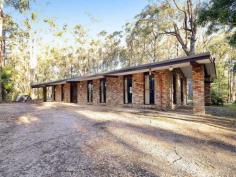 300 Gembrook - Tonimbuk Road Gembrook VIC 3783 Absolute Privacy And Seclusion On 6.6 Acres! Located at the entrance to Bunyip State Park, your privacy and serenity is assured with this 'one of a kind' property. Drive up the long winding concrete driveway to the back of the block where you will find the lovely single level 'ranch' style double brick home-built using handmade 'convict made' bricks believed to be recycled from an old hotel in Sydney. The home is beautifully nestled amongst Australian gums, flora and fauna on a flat and usable plot with scope to put your own 'stamp' on it. Sit and relax on the front patio and watch the extensive bird life, or spot the wallabies and goannas meander by - even koalas have been spotted in the trees from time to time! If peace and quiet is what you are looking for then look no further! Having only one owner since the 1980's, this home has never been offered for sale so take this opportunity to make it your own! Featuring: * 6.6 acres (2.67Ha) approximately of private land * Well-built unique and solid double brick single level home * Large living and dining area with high cathedral ceilings * Functional timber kitchen with quality s/s upright stove, double sink & breakfast bar General Features Property Type: House Bedrooms: 2 Bathrooms: 1 Land Size: 2.67ha (6.60 acres) (approx) Outdoor Features Carport Spaces: 1 Garage Spaces: 2