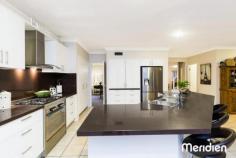 17 Patriot Place Rouse Hill NSW 2155 Elevated & Enormous Family Home - 650m2 Block Situated in a prestigious cul-de-sac this generously proportioned property boasts leafy district views from its elevated position and offers plenty of privacy for you and the family. If you are looking for large, this home will not disappoint. Features: - Wide double door entry opens to the tiled reception foyer - Formal living room and separate formal dining room which boasts direct access to the kitchen, ideal for dinner parties - Magnificent new polyurethane kitchen finished with granite benchtops and splashback and features s/s appliances including gas cook top and dishwasher. There is ample storage available and the large island bench provides a huge breakfast bar and food preparation area that will be appreciated by any chef - Open plan casual living is substantial with a meals solarium and spacious family room both adjacent to the kitchen. The centerpiece of this space is a stunning gas fireplace that's a real talking point - Downstairs also features a study with built-in robes, making it a potential fifth bedroom plus renovated powder room with elegant vanity. - The curved staircase has recently had a facelift with bamboo steps and treads that leads you to the gigantic upstairs rumpus - Four queen sized bedrooms with robes grace the upper level sharing a generous bathroom with double vanity and separate toilet - The master suite is sumptuous in size and perfect as a parent's retreat. The walk-in robe has loads of storage and the elegant ensuite that boasts a spa bath and separate toilet has been stylishly renovated with plantation shutters and new vanity - Outside is a large paved entertaining area covered by two shade sails that is completely private. There is a level lawn area for the kids to run about and provides ample room to add a trampoline or swingset - To complement this large and gracious home there is an auto double garage, two garden sheds and additional parking for a third vehicle or trailer perhaps. - The home features ducted air throughout Enjoy the peacefulness of this location whilst being just minutes to major infrastructure and amenities such as the Rouse Hill Town Centre (where the future train station will be situated). There is an array of local schools all within easy reach and bus transport is readily available. The Caddies Creek Reserve is an easy stroll and the kids will enjoy feeding the ducks whilst you soak up the serenity. PROPERTY DETAILS Status: For Sale Price: Price Guide: Over $890,000 Inspect: 11:00am - 11:45am Saturday, 25 October 2014