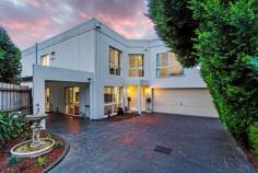 93 Carrington Road Box Hill VIC 3128 Young, Private & Supremely Convenient Families, professionals and investors, would you love a young 2-storey residence in the heart of Box Hill that's contemporary, easy and private? It's just a short walk (about 300 metres) to Box Hill Centro, restaurants and station, yet this stunning 4 bedroom 2 bathroom home is so secluded. Quietly tucked away at the end of a long driveway, you will instantly be impressed by the rendered facade and attractive, easy-care landscaped gardens. Three car accommodation makes parking a breeze and includes an internal access remote double garage and a carport. Stylish, light and beautifully appointed, upstairs you'll discover 4 double bedrooms (BIRs) and a family bathroom. The spacious restful master boasts WIR, split system and spa bath ensuite with double vanity. Two large living areas and a black granite kitchen featuring quality appliances give you space and practicality to relax and entertain. The formal lounge/dining room is highlighted by gorgeous hardwood polished floors, while the sun-filled family/meals room opens to the private covered deck and low-maintenance landscaped garden with a cubby house; for year-round enjoyment. Additional highlights: powder room, ducted heating. General Features Property Type: House Bedrooms: 4 Bathrooms: 2 Outdoor Features Carport Spaces: 1 Garage Spaces: 2