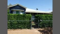 63 Falcon Street, Longreach, QLD 4730 $360,000 With period features throughout this character filled home is the epitome of the breezy Queenslander style. Situated on a 1214m2 block in quiet Falcon Street it sits radiating magnificent street appeal with it's L shaped verandah and large bay window. The kitchen features it's own doorway to the verandah and also has a large bi-fold timber window which makes entertaining easy. The varnished timber bench tops are also an elegant finish. The massive combined lounge and dining room is in the centre of the home and features high, pressed metal ceilings, VJ walls, polished timber floorboards and split system air conditioning.