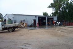 Roger Moore Crescent Warialda NSW 2402 Situated on a 2034m² block with security fence & access through
two sets of double gates. The land has been gravel filled & packed
and is well drained. This all steel workshop has been built for approx
15yrs is 184m²(60’x33’x14’) which includes a lock-up office with A/C,
lock-up parts cage, a 5 tonne loft above office & three phase power.
The shed is served by two side roller doors opening onto a concrete
apron(120m²), one front roller door and a side access door. Included in
this sale is a 4 tonne hoist, Large compressor, 40/ Container, Water
tank, Benches, Vyces, Grinder and three storage cabinets.