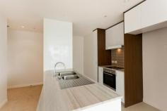 301/1 Mouat Street, LYNEHAM ACT 2602 $335,000 If you are looking for a great investment property or a stylish first home then this apartment may be perfect for you. On offer here is a great location. The Dickson shops and Southwell Park are within footsteps, while the City and CBD are a short drive away down Northbourne Avenue. This particular apartment is in a premier position within Axis. It is on floor eight of eleven, has great views over the surrounding suburbs and playing fields of Dickson and offers a 16 sq m wrap-around balcony that spans the full glass front of the apartment.