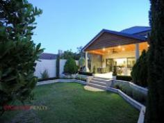 30 TWEEDDALE ROAD, APPLECROSS WA 6153 A stunning architect designed luxury home that is presented as new. With striking street appeal, feature gatehouse secure entry, and generous proportions throughout, here is an executive home set in the heart of one of the most desirable pockets of prestigious Applecross. This impressive executive sized home offers an open plan kitchen family room with enormous high ceilings, an inviting outdoor alfresco area overlooking mature lush gardens, with three