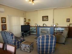 1 Brolgan Rd Parkes NSW 2870 Relax & Enjoy $228,000 This three bedroom home has heaps of appeal and a peaceful outlook across the native garden with views of town, There is a large open plan lounge/ dining room, new kitchen with breakfast bar, pantry, electric under bench oven & natural gas cooktop. There is also an enclosed sunroom, small office and second toilet. With natural gas hot water and heating as well as a split system a/c. Stroll outside and enjoy the landscaped garden, carport with access to the back yard and garage/workshop. This is a very good home at the right price so call to arrange an inspection today.
