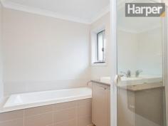 6/7 Fonda Avenue Rutherford NSW 2320 For Sale Offers over $350,000 This as-new contemporary home presents spacious interior living and quality throughout located in an exclusive family-friendly estate just 10 minutes to schools, shops and train station in Maitland town centre, and 45 minutes to Newcastle CBD and beaches. The home’s modern façade combines a full-brick exterior with timber accents and picture windows to build strong street appeal that blends seamlessly into this high-end estate. Enter into a wide tiled hallway that’s bathed in natural light and opens out into the spacious open-plan living/dining room. There are premium floor tiles to the dining area and as-new carpet to the living area that also features a distinctive horizontal picture window that drinks in abundant natural light. The living area opens onto an entertaining patio in the private backyard with a lawn and garden, and the dining area opens to an additional wrap-around verandah. Back inside, the premium designer kitchen adjoins the dining area and features large island breakfast bar, stone bench tops, quality stainless steel appliances including dishwasher, gas cooking and modern glass splashback. The immaculate main bathroom presents a generous glass frame shower, separate bath and modern vanity with stone top and above-bench vanity. The king-sized master bedroom offers a bright and sunny aspect and features a modern ensuite, also with glass frame shower and stone-top vanity. Bedrooms two, three and four are all of generous proportions, and a well-equipped internal laundry and double lock-up garage complete the package. This property features: -- Split-system air conditioning to the main living area -- Premium floor tiles to kitchen, hallway and dining area -- As-new carpet to the main living area and bedrooms -- Quality fixtures and fittings throughout -- Double lock-up garage with automatic roller door To view this property, please call Harper Property Agents on 1300 626 111 Inspections Sat, 01 Nov 01:00 PM - 01:20 PM Features General Features Property Type: Unit Bedrooms: 4 Bathrooms: 2 Indoor Ensuite: 1 Outdoor Garage Spaces: 2