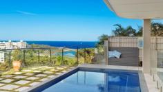 5 Highview Ave Queenscliff NSW 2096 An architectural triumph of the highest calibre, this as-new
contemporary masterwork leaves nothing undone in its quest to provide
the ultimate luxury retreat. Immersed in a sweeping 180 degree northerly
panorama with stunning ocean views, its premier headland setting is
within a few minutes stroll of the beach and village. Tri-level full brick residence with every conceivable luxury Vast open living, dining and family area with gas fireplace Glass bi-fold doors open to in/outdoor entertainers' deck Poolside family room with wet bar flows to covered patio Sophisticated Quantum Quartz island kitchen with butler's pantry Master suite with walk-in robe, ensuite and northerly deck Steam room, 3,000 bottle climate controlled wine cellar Chic bathrooms with heated underflooring, powder room Internal lift to all floors, Sydney red gum flooring, ducted air con Easycare garden with irrigation and automatic heated pool systems Stroll to Freshwater Beach and village, minutes from schools Double lock up garage, media centre, Dynalite smart system, comfort plus glass