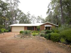 Parkerville WA, 6081 IMMACULATE INSIDE & OUT As you enter this well presented 4 bedroom, 2 bathroom brick family home through the lovely leadlight feature door, you will be impressed by the light and bright atmosphere and the generous nature of the practical floor plan. With formal lounge & formal dining, open plan kitchen / meals / family area and good sized bedrooms. The master bedroom has its own ensuite and walk in robe. Two other bedrooms have built in robes whilst the remaining bedroom has a sizeable robe recess. All bedrooms together with the formal living area are carpeted while the open plan living area has attractive and practical slate floors. With insulation in the ceiling and a slow combustion wood fire you certainly will not feel the cold. And summer is no problem either with the home having ducted reverse cycle air conditioning. A large paved gabled patio is perfect for outdoor entertaining and is accessed from the family area. A double garage under the main roof complete with automatic tilt-a-door is very handy. Nestled on a lovely, shady and well fenced 1800 sqm block located in a quiet, popular street close to playground reserve. The established gardens are full of color at this time of year. The back yard is very private with natural brush fencing around the perimeter, easy care native gardens and reticulated lawn. Hidden away in a far corner of the block is a garden shed and wood shed Just minutes to shops & school, Mundaring village and within an easy commute to Midland and the airport. Nothing to do here other than unpack and enjoy.