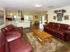 Parkerville WA, 6081 IMMACULATE INSIDE & OUT As you enter this well presented 4 bedroom, 2 bathroom brick family home through the lovely leadlight feature door, you will be impressed by the light and bright atmosphere and the generous nature of the practical floor plan. With formal lounge & formal dining, open plan kitchen / meals / family area and good sized bedrooms. The master bedroom has its own ensuite and walk in robe. Two other bedrooms have built in robes whilst the remaining bedroom has a sizeable robe recess. All bedrooms together with the formal living area are carpeted while the open plan living area has attractive and practical slate floors. With insulation in the ceiling and a slow combustion wood fire you certainly will not feel the cold. And summer is no problem either with the home having ducted reverse cycle air conditioning. A large paved gabled patio is perfect for outdoor entertaining and is accessed from the family area. A double garage under the main roof complete with automatic tilt-a-door is very handy. Nestled on a lovely, shady and well fenced 1800 sqm block located in a quiet, popular street close to playground reserve. The established gardens are full of color at this time of year. The back yard is very private with natural brush fencing around the perimeter, easy care native gardens and reticulated lawn. Hidden away in a far corner of the block is a garden shed and wood shed Just minutes to shops & school, Mundaring village and within an easy commute to Midland and the airport. Nothing to do here other than unpack and enjoy.