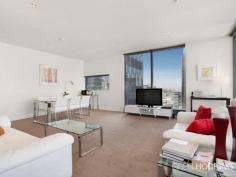 1912/1 Freshwater Place Southbank VIC 3006 Luxury corner apartment with 19th floor city backdrop - approx 92sqm Perched on the banks of the Yarra River in a prestigious resort style address, this flawless corner apartment embodies a sophisticated open gallery design with impressive proportions, exemplary finishes and floor-to-ceiling windows throughout. Captivating city views wraparound the spacious living and dining areas to create a supreme entertainers’ retreat of sheer opulence. An exquisite marble island kitchen serves as a grand space with stainless steel gas appliances and superior fittings. Residents enjoy access to a range of facilities on level 10 including a gymnasium, pool, spa, sauna, steam room, massage rooms and rooftop garden selection of barbecue amenities with a spectacular view. There are two generous bedrooms with built-in wardrobes, including the master retreat complete with walk through wardrobe and ultra-stylish ensuite. Additional highlights include a crisp white marble finished bathroom, ducted air conditioning, chic downlights, video intercom, concealed laundry facilities, secure car space and lift access. It presents a solid investment opportunity with high rental returns, or an impressive option for those seeking a prized lifestyle of supreme ... show more View Sold Properties for this Location View Auction Results General Features Property Type: Apartment Bedrooms: 2 Bathrooms: 2 Indoor Features Toilets: 2 Air Conditioning Outdoor Features Garage Spaces: 1 Swimming Pool - Inground Other Features Built-In Wardrobes,Close to Schools,Close to Shops,Close to Transport,Secure Parking Offers over $750,000