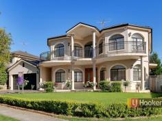 6 Drummond Rd Beaumont Hills NSW 2155 Large Architecturally Designed Home..... This superb family home and not had a cent spare in its construction. Boasting double brick construction with 2.8m high ceilings allows the home to be drenched in sunlight. Located in an enviable position North facing in a quiet location just a stroll to shops, Beaumont Hills Primary and transport. The flexible layout allows for the extended family/in-laws and still has room left over. Home features: * 6 Extra-large Bedrooms with builtins * Main bedroom with walk-in robe and ensuite with spa bath * Large 6th bedroom/study close to full bathroom downstairs with spa bath * Large Main bathroom with spa bath * Open formal lounge & formal dining/study * Fantastic oversized kitchen with granite bench tops, large island, S/S appliances, dishwasher, 6 burner gas cooktop & 900mm oven. Perfect for entertaining. * Meals area & family room flow out to the alfresco area * Balconies upstairs with views over the suburb towards Rouse Hill Town centre * Good size level backyard with room for a pool. * Double auto garage with drive through to concrete area. Extra features: * Video Intercom * Alarm system * Large Zoned Ducted Airconditioning * Ducted Vacuum * Gas points heating & outdoor for BBQ * Instantaneous Gas Hotwater System To find out more about this unique home, call Greg Petrin on 0488 990 520 today. Property Snapshot Property Type: House Construction: Double Brick Features: Alarm Balcony Built-In-Robes Ceiling Fans Close to schools Close to Transport Dining Room Dishwasher Ducted Airconditioning Ducted Vacuum Ensuite Established Gardens Family Room Fenced Back Yard Formal Dining Room Formal Lounge Fully Fenced Yard Gas Granite Benches Intercom Internal Access via Garage Linen Press Lounge Outdoor Living Remote Control Garaging Stainless Steel Appliances Storage Study Undercover Entertainment Area Walk-In-Robes