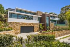 Mosman, NSW 2088 Holding an absolute Balmoral address, no expense was spared with the
construction of this brand new luxurious architectural home. Set on
gorgeous wooded grounds with sun drenched easterly aspect, and across
three floors offering breathtaking panoramic water views overlooking
middle harbor at all living space, this exclusive spectacular residence
represents a unique home to live with a life seamlessly combing
comfort, tranquility, modernity, and connecting into the native
environment. Nature, light, space and style are the defining
characteristics of this exceptional luxurious family home. Striking use
of horizontal elements, straight lines, natural light &
ventilation, high ceilings, and full-height glass creates the most open
concept floor plan with sweeping panoramic harbor views, offering an
ever-changing backdrop. By using natural materials such as
sandstone, timber and marble, the building appears to stay connected,
sit comfortably and peacefully into the native environment. Features: • All living spaces have breathtaking panoramic harbor views. • 4 ensuite bedrooms with huge walk-in wardrobe, study room, wine cellar, and home theater. • Magnificent wet edge swimming pool has expansive harbor views. • Exclusive high-spec custom-made finishes with strong attention to detail. • Double glazed and heat reflective coatings on windows. • Italian designed and made lift with commercial standards. • High-end Italian Calacatta marble throughout the bathroom and laundry. • Exclusive kitchen with Gaggenau appliances • Kohler bathroom and kitchen fittings. • Australian Blackbutt, extra long and wide timber floor • Australian rock-face sandstone wall cladding. • Car turntable • C-Bus technology • Under floor heating • ducted reverse-cycle air conditioning Please contact Monika Tu on 0409 898 888 for more information and to arrange an inspection.