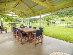 1179 Kilcoy-Beerwah Rd Cedarton QLD 4514 Located in a Lush Fertile Private Valley Between Peachester & Woodford * Permanent Flowing Creek that Runs almost the Full Length of the Property * Water Provision for Internal Paddocks from 5,000 Gal Header Tank * Five Paddocks with Barb & Electric Fencing * Cattle Yards with all Weather Crush * Machinery Shed plus 9mt x 6mt Shed * Private All Weather Road has 2klm of Post & Rail Fencing * Magnificent High Set Sandstone Brick Mansion * Grand Entrance Vestibule with Cathedral Ceiling & Crystal Chandelier * Timber Staircase opens onto a Formal Lounge with 11ft Ceilings Featuring A Beautiful Chandelier * Upstairs Living (390m2 incl Balconies & Verandas) * Spacious Lavish Master Bedroom has W.I.R & Ensuite * Guest Bedroom with Ensuite plus Two other Bathrooms & an Office / Sitting / Reading Room * Gourmet Kitchen with Gas Cooking & Dishwasher * Formal Dining & Family Room * Main Bedroom with Claw Foot Bath * Downstairs (300m2) access from Entry Foyer to Large Area which could be Rumpus / Craft Room / Studio or Workshop * Laundry / Toilet / Shower * Large Double Lock up Garage * 2x 5,000 Gal Tanks Connected to the House * Fully Covered Outdoor BBQ Area Completes the Picture * Separately Fenced House Yard Tastefully Landscaped * A Must To Inspect For A Genuine Buyer Looking For The Ultimate Property * Inspections by Appointment Only