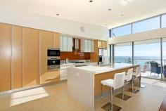 17/11 Halls Head Parade Halls Head WA 6210 Offers Over $1,000,000 LUXURY PENTHOUSE PANORAMA OPEN BY APPOINTMENT ALL WEEKEND! Live the ultimate beach lifestyle in this luxurious penthouse apartment located in the prestigious Old Halls Head. Enjoy panoramic views up the coast and across to Mandurah Marina from the huge entertainers balcony. The unique apartment is fitted out using only the highest quality fixtures and fittings, and a well designed floorplan with high ceilings and wooden floorboards complete the feel. The designer chef's kitchen overlooks the open plan living area and has an abundance of cupboards, Miele appliances, a built in coffee machine and microwave, and is finished off with Corian benchtops. The floor to ceiling windows and sliding doors take in the expansive views and are finished with remote controlled blinds. A separate and cosy theatre room is adjacent to the main living area and features a Mitsubishi projector, big screen and Bose surround sound. Relax in the hotel style master suite with an impressive open ensuite, freestanding bathtub, twin vanities and waterfall style shower. Open up the curtains and you have direct access to the balcony through sliding doors. All the bathrooms are all finished off with Corian benchtops. The guest suite has its own private ensuite and double sliding wardrobes and the third bedroom has access to a guest bathroom. The property also features Daikin reverse cycle airconditioning, a gym, alarm system and secure parking for three cars. Also conveniently located above a Dome cafe and across the road from the popular Doddies Beach, this apartment is a must view. Call Exclusive Listing Agents Daniel & Chelsey for a private inspection on 9550 2027 or 0418 883 535.