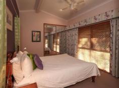 3 Greenhill Grove Daisy Hill QLD 4127 LIVE AMIDST LEAFY SERINITY RIGHT BESIDE JOHN PAUL COLLEGE! Positioned amongst the trees in a highly sought after pocket in Daisy Hill and within walking distance of John Paul College, this split level home is comfortable, convenient and surrounded by filtered sunlight and forest views. From the outside this timber home presents as simple and unpretentious, imposing minimal impact on the site. Inside, the design strives for a relaxed ambience. An abundance of windows frame the forest and allow plentiful airflow. This home boasts timber floors throughout and a large covered entertaining deck adjacent to the kitchen. Substantial bedrooms connect over three half levels as the layout of the home flows down the slope and cantilevers into a tree filled gully. An enormous room on the lowest level, complete with kitchenette, ensuite and separate side access is perfect for dual living or as a teenagers retreat PROPERTY FEATURES: Four bedrooms and three bathrooms Granny Flat (fourth bedroom) with kitchenette and ensuite Timber floors throughout living areas Multiple outdoor living decks and terraces Ducted reverse cycle air conditioning to main house Slow combustion fireplace Split system air conditioning in granny flat 5,000 litre (approx.) water tank Rental appraisal at $490 - $510 per week LOCATION AND INFRASTRUCTURE: Within walking distance of John Paul College and only a short distance 2 minutes to Daisy Hill Forest 5 minutes from the M1. 5 minutes to the Logan Hyperdome and Brisbane busway 30 minutes to Brisbane CBD 30 minutes to the Gold Coast Other features: Built-In Wardrobes,Close to Schools,Close to Shops,Close to Transport,Fireplace(s)