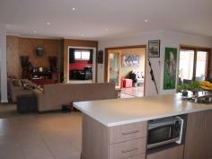 22 Mariner Pl Inverloch VIC 3996 NOW THAT'S ENTERTAINMENT !Looking for a large home to accommodate that growing family or entertain all those friends, then here it is. Located less than a 10 minute walk to the Surf beach is this modern residence boasting four bedrooms (with walk-in robes), study, two living areas, an ensuite (with double shower & vanities) and bathroom (with spa bath). A large open plan living area leads into the rumpus room or covered outdoor deck. Then there's every man's dream with a workshop in an extra large double garage, and parking for the boat or caravan off to the side.