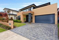 20 Cadman Ave West Hoxton NSW 2171 Designed with lifestyle in mind this superbly presented 4yr old 'Eden-Brae' designer home is a very impressive family residence, overflowing with the finest of finishes throughout. Boasting multiple living areas and an easy-care lifestyle, it is perfect for today's contemporary family. The home offers many sought after features. 4 great sized bedrooms upstairs all with their own private luxury ensuites and walk- in robes, the master bedroom also has a spa bath in its ensuite, a walk-in robe and balcony. For the family that loves to entertain you are presented with this stunning open plan luxury kitchen with gas cooking, electric oven, stone bench tops, dishwasher and breakfast bar with living room adjoining. Elegant living room with high ceilings and an abundance of natural light, a fireplace, dining area flows from the kitchen, a spacious theatre room and large laundry with extra storage area. There is internal access from the double lock up garage, plantation shutters and block out blinds, with tinted double glazed windows at the front. Situated in a highly sought after locale within short walking distance to private high school, local shopping centre and amenities and surrounded by like homes, this is one to add to your "Must See " List. Call NOW.
