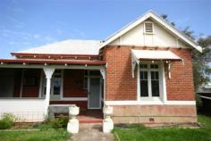 Narrogin WA, 6312 Location Location Location! A rare opportunity has arisen to secure this charming character cottage located within Narrogin's central business district. Currently used as a residence and returning a good rental income the land is zoned "Central Business" which opens up a range of possibillities not available ion a residential zoned property. Situated in a restricted speed zone on a main through road the property lends itself well to a business use or it can be kept as a residential dwelling where the new owners can enjoy a cafe lifestyle within very easy walking distance to shops, cafes, hotels, sporting and other facilities. With a near ground level rear entrance the home could suit a retired couple looking for a character home with a small easy care garden not in a complex. The home has reverse cycle airconditioning to two rooms, electric range cooker and oven, dishwasher and instant gas hot water system. With a quality tenant in residence the property can be secured now to be further devloped into a business premises at a later date, or contact elders Real Estate to find out when the lease expires so you can move in yourself. Other features: Close to Schools,Close to Shops,Close to Transport,Garden,Secure Parking,Formal Lounge