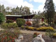 66 Dalcouth Road Stanthorpe Qld 4380 3 BEDROOM, 2 BATHROOM HOME ON JUST UNDER AN ACRE
Bordered by lovely gardens and lawns is this charming 3 bedroom
western red cedar home, less than 5 mins from town on just under an
acre. Featuring an open plan living design with the lovely pine kitchen
overlooking the lounge and dining areas, this home also boasts three
built-in bedrooms, WIR off the master, two bathrooms, a well positioned
enclosed sunroom and a large front verandah overlooking the gardens and
pond. Also boasting wood heating plus reverse cycle air conditioning, a
6m x 9m single remote lock-up garage with plenty of storage/workshop
space, 9,400 gallons of rainwater and a covered barbeque area, this
property represents true value for money and an inspection is highly
recommended. Contact Scott Mann on 0427 814 444 or Simon Leigh on 0418
790 070 to arrange an inspection.