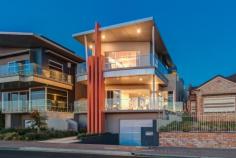 160 Esplanade Brighton SA 5048 Perfectly positioned on Adelaide's best coastal strip and moments from the beach, offering luxury and lifestyle at its very best. Sited on desirable, and manageable allotment of 563sqm approx and built by Tanti Constructions, this exceptional Esplanade entertainer was built using the highest quality materials and unsurpassed craftsmanship which sublimely emphasises a blend of rustic and contemporary themes including a lift servicing all 3 levels… An outstanding example of a grand and edgy contemporary build. The expansive open plan living areas on the ground floor comprise of 3 sections which can be independently segregated through stylish sliding glass partitions, the front being formal living/dining and balcony with some of the most stunning views you'll ever see in a beach side home. The middle section comprises an expensive kitchen with a gorgeous dark Antique Brown granite benchtops, appliances by Miele including; induction cooktop, steamer, oven, warming draw, and an abundance of storage in the 2 pac cabinetry. There is also a large power room, spacious pantry, separate laundry with outdoor access, informal dining, and breakfast bar seating. The rear section is used primarily as a TV room or retreat, and also have a small study nook. Upstairs there is a total of 5 bedrooms and three bathrooms, the master with Balcony, ensuite and double walk in robe, bedroom two also has an ensuite with built in robe, and bedroom five at the rear with east facing balcony and built in robe.