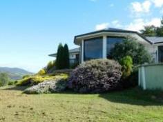 20 Scenic Hill Road Huonville TAS 7109 Magnificent Home, Magnificent Views This grand home reigns over the township of Huonville, the Huon Valley and the beautiful Huon River. Surrounded by an acre of garden, two minutes to the shopping centre, 35 minutes to Hobart and with cows grazing next door, the property certainly has absolutely everything you dream of. Floor to ceiling windows and external decks allow you to enjoy the full panorama while you entertain both indoors and out. The home has a large open central living area, with a state of the art kitchen positioned to one side. There are two wings to the home. The master bedroom, walk-in robe and en-suite, office and two larger rooms, are in one wing while the main bathroom and three spacious bedrooms, all with built-ins, are in the west wing, suggesting the home will suit the extended family, the entertainer, or just great for when the teenagers return. Double garage, carport, garden shed along with plenty of open parking on this internal block also make it ideal for those of you with lots of toys. Please call Derwent Real Estate to organize a private viewing. General Features Property Type: House Bedrooms: 5 Bathrooms: 2 Building Size: 222.97 m² (24 squares) approx Land Size: 0.51ha (1.26 acres) (approx) Indoor Features Ensuite: 2 Living Areas: 2 Toilets: 2 Study Built-in Wardrobes Dishwasher Outdoor Features Remote Garage Secure Parking Carport Spaces: 2 Garage Spaces: 2 Open Car Spaces: 4 Deck Outdoor Entertaining Area Shed Fully Fenced Offers Over $549,000