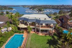 12 Edgecliffe Esplanade Seaforth NSW 2092 Resort
style with a floor plan designed for entertaining makes this impressive
waterside property a standout option for families that love living life
to the full. Enjoying
the exclusive surrounds of Edgecliffe Esplanade, its inspired design
fully capitalises the truly spectacular 180° panoramas over Middle
Harbour from Northbridge, the City and through to The Heads. Su perb
interiors are perfectly laid out for premium family living. The elegant
formal lounge and dining are framed in walls of glass constantly
drawing the eye to the visually exciting panorama. The casual living and
dining also enjoy water views and are well placed next to the large
granite kitchen whilst a further family room provides an ideal teenage
retreat. The
rear of the property is equally as beautiful, enjoying a premium North
aspect, generous alfresco terrace, solar heated pool, level lawns and
versatile poolside cabana / self-contained accommodation. There is rear
lane access to a further car space, boat or trailer storage area. The
grand master retreat is a perfect parental hide-away featuring a
stunning terrace over looking Middle Harbour, his and her dressing room
and marble ensuite. Four additional substantial bedrooms with built-in
robes, marble ensuite or bathroom are complemented by a large home
office with ensuite.
