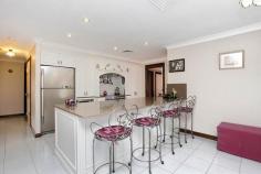 63 Myall Rd Casula NSW 2170 Being offered to the market for the very first time comes this wonderful home on 630.7sqms of land. A large frontage and a 2 1/2 car garage with drive through access allows for plenty of parking space. It features an elegant formal lounge and dining room, accompanied by a state of the art kitchen (recently renovated) and an extra large meals/entertaining area. There are 4 bedrooms, all with ultra modern ceiling fans, ducted air throughout the home and recently renovated main bathroom and en suite. The backyard has a storage shed and is a fantastic size with opportunity for a pool and an extended entertaining area. This home is complete leaving you absolutely nothing to do but move in and enjoy. If you are looking for that perfect family home... Look no further, book your inspection today and make it count!