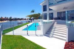 Broadbeach, Gold Coast QLD 4218 $2,150,000 Carmel house is a new contemporary designed home located in one of the most prestigious areas of Broadbeach Waters on the Gold Coast, Australia. This magnificent house is positioned on the wide water bend of the canal which opens to a 270 degree view of beautiful wide waterways. All fittings and finishes were completed with the owner’s highest quality requirements. The main features of the house includes: · Well-designed floor plan with careful consideration given to comfortable family living · Spacious open plan living and dining areas with the floor to ceiling windows which highlight the stunning water views · Luxurious kitchen with Ceasarstone bench top plus an impressive island bench with a quality dual sink, high quality Bosch appliances and six burner gas cooktop · Second living / sitting area which could be used as a formal lounge or home theatre · A well-appointed office with separate entrance away from the main living areas