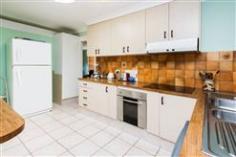 39 Ashbourne Terrace Biggera Waters QLD 4216 Solid Brick 'n' Tile Home on 617m2 Res B Duplex Block! This solid brick and tile family home with an elevated position in a quiet street is an ideal renovation project or to just hang onto for future development. Offering four spacious bedrooms, three of which have built-in robes there is plenty of space for the whole family. The super-sized master bedroom, which is air-conditioned has a walk-in robe as well as a large ensuite with a bath. The fully tiled kitchen is the centrepiece of the home and is adjacent to the large casual dining area which opens up to the massive undercover area making entertaining a pleasure! There is a lot of bench space and plenty of cupboards as well! The living room is exceptional in size and has a multitude of windows to offer natural light as well as those cooling afternoon sea breezes to keep you comfortable. There is even a separate dining room for those more formal occasions! The home also comes with security doors and screens on most windows, solar hot water and sunlights to keep energy costs low. The yard is fully fenced and there is plenty of room for the kids to kick a ball or play with the family pet, and there is even side access for boat or trailer . General Features Property Type: House Bedrooms: 4 Bathrooms: 2 Land Size: 617 m² (approx) Outdoor Features Garage Spaces: 1 Other Features Property Type: Land, House $580,000