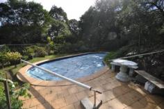 594 Binna Burra Road Beechmont QLD 4211 Picturesque Getaway Located in the mountains of Beechmont is this archtectually designed split level home. Ideal for the whole family, B & B, Holiday Letting etc. Set on 4 acres (16630m2) of ample flora and fauna, ideal privacy. This property boasts: * 5 bedrooms * 3 bathrooms * 4 car garage * 2 carport space * Covered outdoor entertaining area * Inground solar heated swimming pool * Family room on the middle level, for privacy and convenience for the whole family * This home features a warm and inviting feel to it with an abundance of timber used throughout, lets out a country feel to it + combustion fire place * Located only minutes from the local Binna Burra Lodge, approx. 15 minutes from Canungra Township, 30 minutes to Nerang. An inspection will impress. General Features Property Type: House Bedrooms: 5 Bathrooms: 3 Land Size: 1.66ha (4.10 acres) (approx) Indoor Features Ensuite: 1 Toilets: 3 Study Floorboards Broadband Internet Available Built-in Wardrobes Dishwasher Open Fireplace Outdoor Features Secure Parking Carport Spaces: 2 Garage Spaces: 4 Balcony Deck Outdoor Entertaining Area Shed Swimming Pool - Inground Eco Friendly Features Solar Panels Water Tank Greywater System Asking $775,000