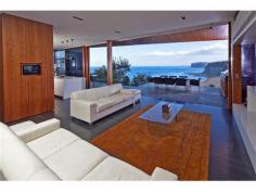 32 The Serpentine Bilgola NSW 2107 SHEER BEACHFRONT LUXURY Created by CABE, one of Australia’s preeminent development companies and winner of 31 industry awards, this is the ultimate seaside retreat for the cutting-edge Connoisseur. Apart from the breathtaking Oceanfront location and spectacular views across the Pacific Ocean and pristine coastline, the attention to detail and high quality fit-out, is nothing short of stunning. No expense has been spared in its creation, from the level street access with elevator to all floors, to the automated doors revealing a view-swept infinity pool and magnificent oceanfront lawn. Accommodation comprises 5 bedrooms, 4½ bathrooms, extensive living and entertaining areas, separate Home Office, thermo-controlled Wine Cellar, media room, gourmet kitchen and enormous storage areas. A rare offering in such a prized position, this luxury property is one that has definitely raised the bar for excellence in this country. *** BE SURE TO VIEW OUR AMAZING 2min VIDEO TOUR ONLINE AT maxwalls.com/id141
