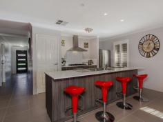 51 Rubens Circuit Baldivis WA 6171 SIMPLY STUNNING HOME!! It is always a pleasure to bring to the market a home that is beautifully presented inside and out and this particular home is no exception! This four bedroom, two bathroom home is not only stylish and sophisticated, but also a smart investment! No expense has been spared on the quality fixtures and fittings that are evident as soon as you enter this stunning home. At the front of the home is a fabulous home theatre room where you can relax and unwind. The stunning master suite, sports an enviable His and Hers walk-in robe and an elegant ensuite with a double vanity and stylish twin square basins. The remaining three bedrooms are a good size and have been tastefully decorated. The chic modern kitchen with stone bench tops has quality 900mm appliances and stylish feature lighting in the dining area, which flows through to the open plan living space. Here there are neutral tones which add to the sophistication of this beautifully styled home, with the finishing touches of white timber shutters which are prominent throughout the home. This light filled room leads out to the timber decked outdoor entertaining area which is the . General Features Property Type: House Bedrooms: 4 Bathrooms: 2 Land Size: 390 m² (approx) Indoor Features Toilets: 2 Alarm System Air Conditioning Outdoor Features Garage Spaces: 2 Other Features Built-In Wardrobes,Close to Schools,Close to Shops,Close to Transport,Garden From $429,000