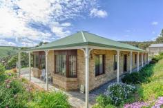 113 Old Willunga Hill Road Willunga SA 5172 A LIFESTYLE INVESTMENT A unique home designed and built by the current owners stands nestled into the Old Willunga Hill escarpment and offers approximately 2 acres of predominately steep fully fenced land boasting a breathtaking rural vista across the Willunga/McLaren Vale vineyards to Gulf St Vincent and beyond. The home which is of generous proportions is surrounded by essentially flat land and offers plenty of off-street parking for pleasure and work vehicles, boat and/or caravan. Comprising a tiled entry with an adjacent home office/study, formal lounge and dining rooms with feature bay windows. A large open plan family room with stunning 'bow window' to capture the amazing panoramic views of the historic township of Willunga and the rolling plains below also incorporates a well appointed kitchen which features timber bench tops and mini orb cabinetry, 900mm gas hot place, underbench oven, built-in-dishwasher and large walk-in-pantry. The family room area also boasts a 'state of the art' entertainment system. The main bedroom features a bay window, large walk-in robe and ensuite bathroom, bedrooms 2,3 & 4 also have access to fitted built-in-robes. The family or guest bathroom . General Features Property Type: House Bedrooms: 4 Bathrooms: 2 Indoor Features Toilets: 2 Outdoor Features Garage Spaces: 4 Other Features Built-In Wardrobes,Formal Lounge,Separate Dining $649,000-$699,000