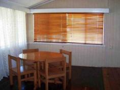 18 Kent Street Bororen QLD 4678 ABSOLUTE BARGAIN! This cosy timber Queenslander home is situated close to the local Bororen School and is within a short stroll to the shops. Stepping up 4 steps you are greeted in an enclosed sunroom that offers great extra living space. Down the hallway it opens up into the living and dining area that features an combustion heater. The kitchen is tucked away just off from the living and dining area and offers timber bench tops, free standing oven, breakfast bar window. Two large bedrooms with built in robes and one fitted with air conditioning. Extra bedrooms have been made to suit your family. Vibrant large bathroom provides bath, separate shower & ample storage space. Outside features a huge undercover entertainment area that flows seamlessly into the backyard. Above ground pool and rock fire BBQ is great for those hot summer days shared with friends and family. Tranquil pond with small bridge leaping over it, adds that extra special touch! Side access with extra shed space at the rear and single carport tops it off. Easy access to the Highway and a 25 minute drive to Tannum Sands. View Sold Properties for this Location View Auction Results General Features Property Type: House Bedrooms: 2 Bathrooms: 1 Land Size: 1100 m² (approx) Outdoor Features Garage Spaces: 1 Swimming Pool - Above Ground Other Features Above Ground Pool, Close to Schools, Entertaining Area, Established Gardens, External Water Feature $222,000