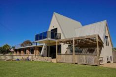 32 Beach Rd Ulverstone TAS 7315 Situated in one of Ulverstone's most tightly held locations by the beach Take a virtual tour by clicking on the video link on this page Situated in one of Ulverstone’s most tightly held locations, this private modern home is virtually on the beach in a peaceful and relaxing setting. Set on half an acre of easy care gardens, the home has four bedrooms, three with built in wardrobes and the main with an ensuite and walk-in wardrobe. Three living areas include; a rumpus room, an ideal teenage retreat; a formal lounge room with raked ceilings and timber feature walls and sea views; a family room that adjoins the dining area and the delightfully appointed kitchen. The main bathroom is spacious with an airy feel. There is also a double garage with remote controlled openers and internal access plus a shed and covered work area. A number of outdoor living areas ensure you can always find a spot to get away from it all. You’ll also enjoy some of the local bird and wildlife right at your front door. All this is in a safe family environment close to a choice of schools (including a high school at Leighlands) and only a short drive or a 20 minute level walk to the Ulverstone town centre if you’re feeling energetic. In a setting like this, it’s like being in a resort on a permanent holiday. Call today to arrange an inspection, you’ll love it!