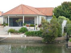 1/21 King Street Paynesville VIC 3880 FIRST CLASS - WATERFRONT TOWNHOUSE WITH JETTYImmaculate waterfront home with jetty. Ideally located in the heart of Paynesville and within walking distance to shops, lake, local cafes and restaurants. Very well appointed with quality finishes throughout, open plan living with new kitchen which overlooks the water, front deck for entertaining, three bedrooms, the master has ensuite and enjoys views of the canal, bathroom, separate laundry, fully ducted heating/cooling, car garage and carport. Lovely private rear courtyard with mature trees and shrubs. Only minutes by boat to McMillan Strait.
