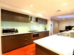79 The Promenade Wattle Grove WA 6107 Wattle Grove Masterpiece Inspection Times: Sun 09/11/2014 02:00 PM to 02:30 PM As soon as you step into this beautifully presented property you will be impressed by the size and space this 4x2 family home has to offer. High ceilings throughout add to the sense of space in this home as you step through the double front doors into the large foyer. You will be blown away by the sheer size of the master bedroom and en-suite bathroom with double vanities, twin shower heads, separate toilet and his and hers walk-in robes. Walking into the main living area again you will be wowed by the beautiful solid timber floors which are throughout the home and by the size of the open plan living/dining and beautifully appointed kitchen with stainless steel appliances, glass splash backs, corian bench tops and an abundance of cupboard space which is complimented by a huge walk-in pantry. A large theatre room with twin entries awaits off the foyer and living areas and is perfect for a family movie night. The remaining three queen size bedrooms all have built-in-robes with the laundry also having a large walk-in linen cupboard and plenty of cupboard space. The open plan living area opens out onto a large timber deck area with built-in cupboard and sink perfect for outside dining. The deck is wired for sound and there is a large powered shed again with a sink. There is also side access with enough room for a caravan or boat. Close to transport, shops and within walking distance to the local primary school you can simply move in and start living as everything in this home has been carefully thought out for easy family living.