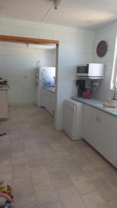13 Hubble St South Carnarvon WA 6701 A MUST TO INSPECT Three bedroom block residence with airconditioning in lounge, dining/kitchen, main bedroom and bedroom 2. The separate lounge is brightly decorated with ceiling fan and aircon plus vinyl floor coverings. The airconditioned main bedroom leads off from the lounge with ceiling fan and built in robes. The bathroom offers a shower recess, toilet and vanity with the laundry houses a second toilet. The spacious gallery kitchen has dishwasher, electric hot plates and electric wall oven and the hot water system is also electric. The welcoming front decking and the rear patio along with the immaculately presented terraced gardens and the 9 metre by 4 metre colour bond garage are a bonus to this well presented property. A must to view to appreciate. Other features: Garden,Secure Parking,Formal Lounge,Separate Dining