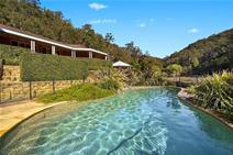 110 Rosehill Lane Yarramalong NSW 2259 LIFE STYLE FIT FOR A KING Central Coast hinterland nestled in the prestigious Yarramalong Valley, sits this master built north facing country style residence on 39 acres. With a relaxed indoor/outdoor living on a grand scale, the substantial executive estate offers a secluded and private location surrounded by established manicured gardens, a perfect blend of open fenced paddocks and timbered hillsides. Close to the Yarramalong Village, Westfield Shopping centre, private schools, train stations, golf course and 45 minutes to Wahroonga this blue chip property also offers: A grand entrance, impeccable design and finely finished single level residence. Gallery style hallways with art lighting Soaring ceilings Formal study/library with combustion fire place, separate large TV room. Exceptional light filled open plan kitchen, dining and living all flowing onto north facing luxury style pool. Fully landscaped and fully fenced, outdoor living at its best. Supremely spacious layout with stunning views of the estate, all set in your own private valley. 6 spacious bedrooms, main with ensuite and walk through robe Home office ( work from home ) Abundant ... show more View Sold Properties for this Location View Auction Results General Features Property Type: Acreage/Semi-Rural Bedrooms: 6 Bathrooms: 3 Land Size: 15.78ha (39.00 acres) (approx) Outdoor Features Garage Spaces: 3 Offers Over $1,450,000