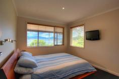 16 Rushes Bay Avenue East Jindabyne NSW 2627 Magnificent lake and mountain views. This beautifully renovated 3 bedroom house sits on typical large tree covered block in East Jindabyne. Upstairs, a modern open plan living/dining/kitchen area leads out onto a spacious deck where the views are at their best. Two good sized bedrooms, a study, and a renovated bathroom are also upstairs while the third bedroom (with ensuite) and a huge rumpus room/ 2nd living area are downstairs. The backyard has a paved entertaining area and a level grassed area both surrounded by low maintenance, established gardens. Property Code: 271 View Sold Properties for this Location View Auction Results General Features Property Type: House Bedrooms: 3 Bathrooms: 2 Outdoor Features Carport Spaces: 1 Garage Spaces: 1 $469,000
