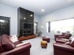 29 Kittles Rd Shepparton VIC 3630 Ultra Modern Spacious Entertainer This home with a most flexible plan is all you've ever wanted and more! It's in a fantastic low traffic street and just off The Boulevard in Kittles Road opposite open space and picturesque gums. The neighbourhood is peaceful and quiet but you're only a short drive in to Shepparton. The home itself was built only 3 years ago and is striking in its contemporary design incorporating 9-13ft ceilings with huge window frames, it has a mighty street presence. It's nestled comfortably on a 790sqm landscaped allotment with magnificent gardens and established trees. Inside the home is just breath taking from the moment you walk through the massive front door, stepped entry foyer with intricate floor tiling you know you're in for a treat. The main hub of the home combines lounge, kitchen and family room plus a summer room. It's a huge open space where you can entertain formally or alfresco style, you'll never have to worry about the weather. The chic kitchen is extremely well designed, all stainless including flush fitted microwave and cool filtered water, gas appliances and the pantry has to be seen to be believed! All of the rooms are a generous size, master bedroom with full ensuite and HUGE walk in robe. Second bedroom is designed to be a bed sitter with its own bathroom and you can use the third bedroom as a living room if you desire. Quality fittings throughout, designed and used practically, to the highest standard. Aside from all this, more features include: -Ducted cooling & heating -Double garage -Separate workshop -Spa in the backyard -Full sprinkler system If you're looking for a home with a flexible plan, stylish yet practical with plenty of family space then this is it!