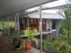 2225 Lake Moogerah Road Moogerah QLD 4309 Executive style property on 73 acres Basking in the grandeur of Mt Greville, Zengarra is situated in the heart of the Scenic Rim. The current Owners have developed and improved the property over the past 9 years, but now wish to downsize and have instructed us to sell. Zengarra is all about self - sufficiency, privacy and the preservation of the environment. Situated within it’s bush surroundings, it is easy to believe you are a million miles away from the city. In reality the property is a mere 6km from the Cunningham Highway and a 70 minute drive from Brisbane. Zengarra’s thoughtfully devised layout ensures it is the perfect residence for entertaining. Features include: • Three individually styled luxury suites, each with ensuites • Separate pavilion with a distinct oriental influence contains the lavish master suite including a spa & walk in robe • Living areas with 5 metre high cathedral ceilings and fire place • Commercial kitchen with top of the range appliances throughout • Acoustically balanced, multi - purpose studio • Solar heated, in-ground pool • Covered deck overlooking the pool • 33m x 9m steel frame shed • Orchard with an abundance of fruit. General Features Property Type: House Bedrooms: 4 Bathrooms: 4 Land Size: 29.54ha (73.00 acres) (approx) Outdoor Features Open Car Spaces: 10 $849,000