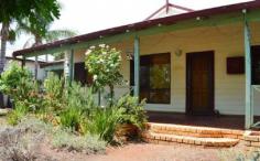 193 Piccadilly St Piccadilly WA 6430 This lovely 4 bedroom, 1 bathroom home on bustling Piccadilly Street is a must see for the growing family or the buyer in need of space. Greeted by the lovely established gardens tucked behind a picket fence is this picturesque cottage. The home has a lovely porch that runs most of the length of the home with a beautiful wooden floor this is the perfect place to watch life go by with your favourite beverage in hand. The front door leads into the first of two spacious living areas this home has to offer, with lovely polished floorboards that feature throughout the living, dining and kitchen. The living area takes you through to the open plan kitchen and dining area that is both spacious and functional. The kitchen offers separate oven and stove top, dishwasher, fridge recess and breakfast bar. This room is brightened by a skylight overhead and has a sliding door taking you out to the outside entertaining area. Off the dining room is the huge carpeted family room, this room is huge and big enough to function as a playroom for the kids and/or the adults. The master bedroom and bathroom are located off this room also. The master is spacious with built in robes with mirror door sliders and has the function of an access door through to the bathroom. The bathroom is huge with separate bath and shower, toilet, double door vanity and large double door cupboard storage will never be a hassle again! All four bedrooms have BIRs. The outside entertaining area is fantastic with wrap around veranda and shade sail entertaining areas to soak up the sun after a dip in the sparkling below ground swimming pool. There is a good size grass area for the kids and for the boys a powered workshop and two adjoining single carports for your toys, there is also a smaller garden shed to the rear and rear lane access. Don’t miss out on this feature packed home close to shops, oval, hospital and a stroll away to the CBD contact Lucinda now to secure your own private viewing on 0409 206 942.