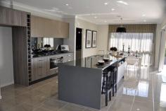12 Mcgrath St Bakers Creek QLD 4740 Elegant. Sumptuous. Opulent. These are all apt descriptions for this stunning home at Ooralea Waters Mackay. * Decadent master suite. Close the door and you are in your own zone - feels like a posh 5 star hotel with open plan ensuite. Double vanity, huge shower room, and dazzling walk in dressing room with its own Hollywood glamour - a chandelier! * Stunning living areas. 3 separate zones. All tiled and air conditioned and ready for your family. There's the generous lounge that adjoins the kitchen and flows out through the stacker doors onto the tiled patio. Or why not relax with a book in the rumpus room at the rear of the home. A full wall of glass plus stacker doors makes you feel like you are part of the backyard. Or close it all up and be tucked away from the world. If these two areas aren't enough there is the additional family room. Tucked away near the bedrooms its an ideal reading zone or space for the kids. It too has large stacker doors that bring the outside in to you. * Exquisite kitchen. Butlers pantry & wet bar. Stone benches, mirrored splashback, 900mm oven and gas cooker, pantry, island bench......words are not enough to describe this gleaming space. It overlooks . General Features Property Type: House Bedrooms: 4 Bathrooms: 2 Building Size: 288.90 m² (31 squares) approx Land Size: 717 m² (approx) Outdoor Features Garage Spaces: 2 From $599,000